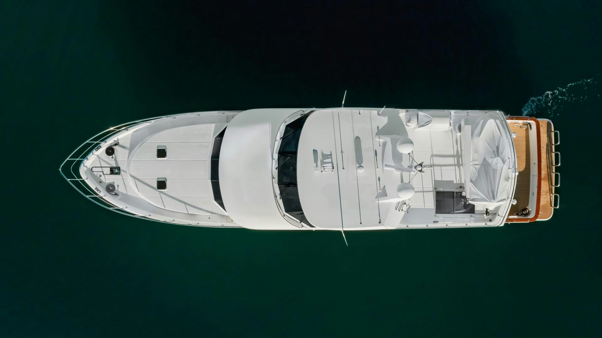 a white and green sign aboard OBSESSION Yacht for Sale