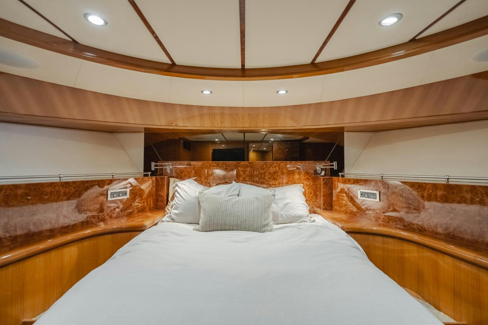 a room with a bed and a fireplace aboard OBSESSION Yacht for Sale