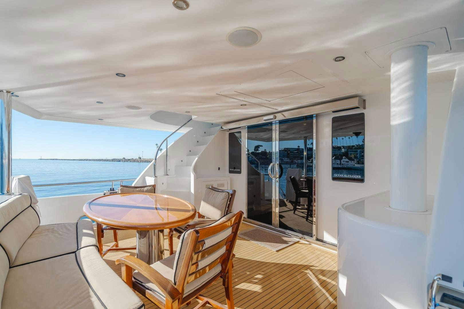 a room with a table and chairs aboard OBSESSION Yacht for Sale