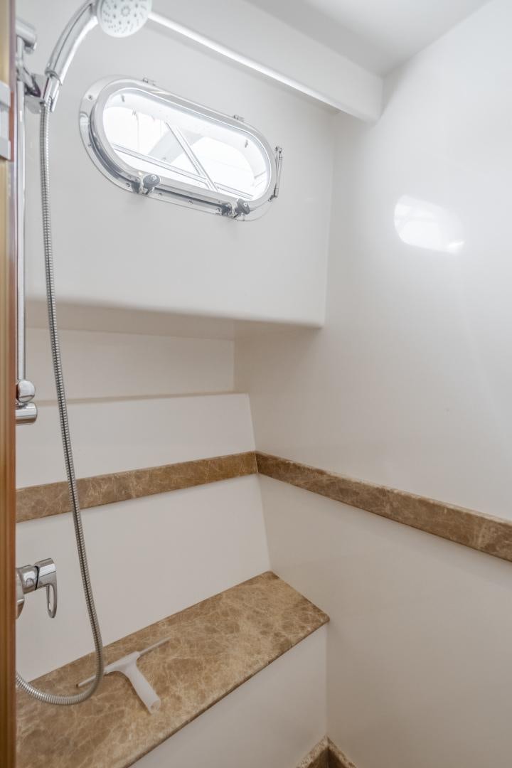 a shower unit in a bathroom aboard OBSESSION Yacht for Sale
