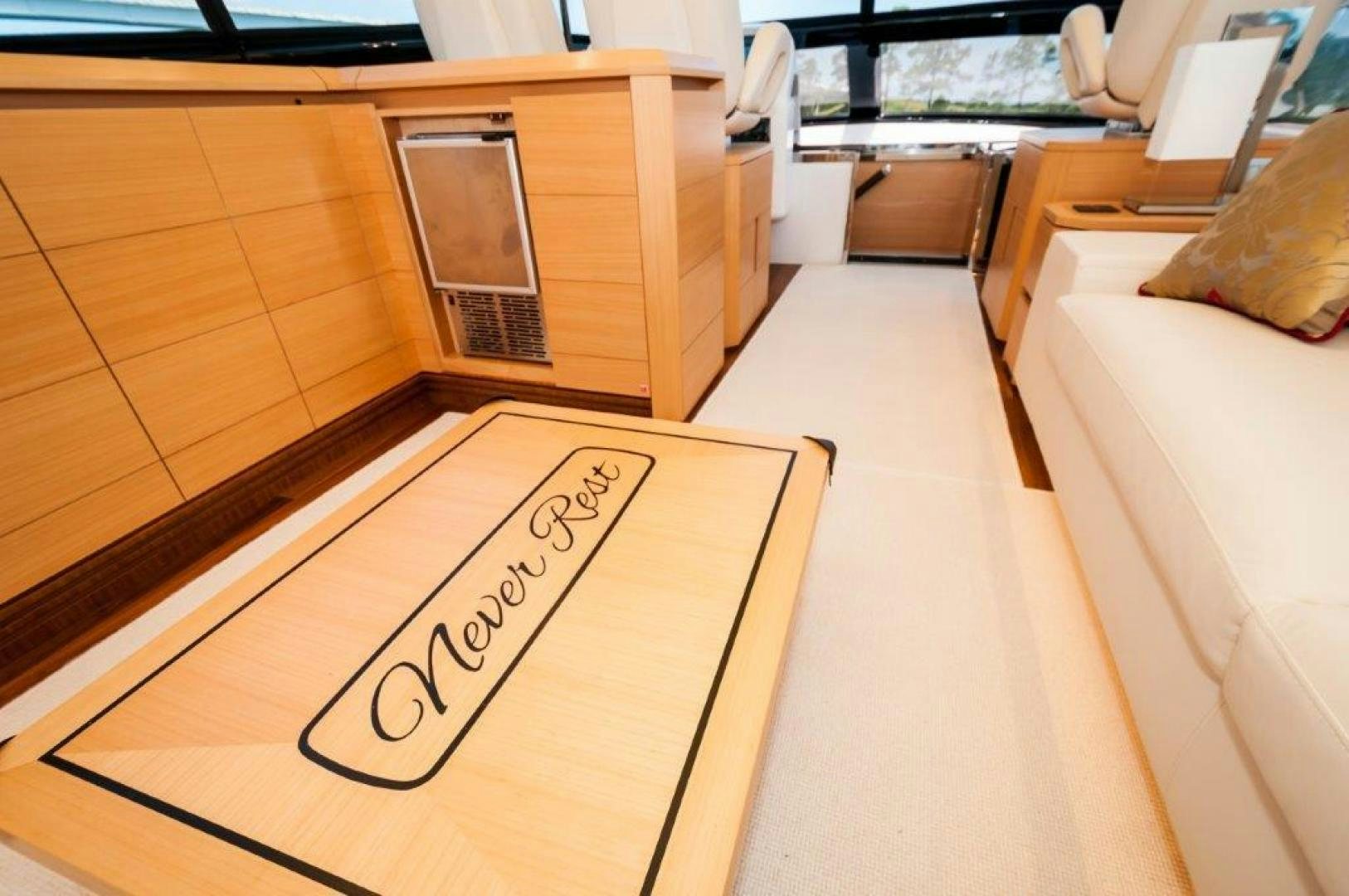 a room with a bed and desk aboard NEVER REST Yacht for Sale