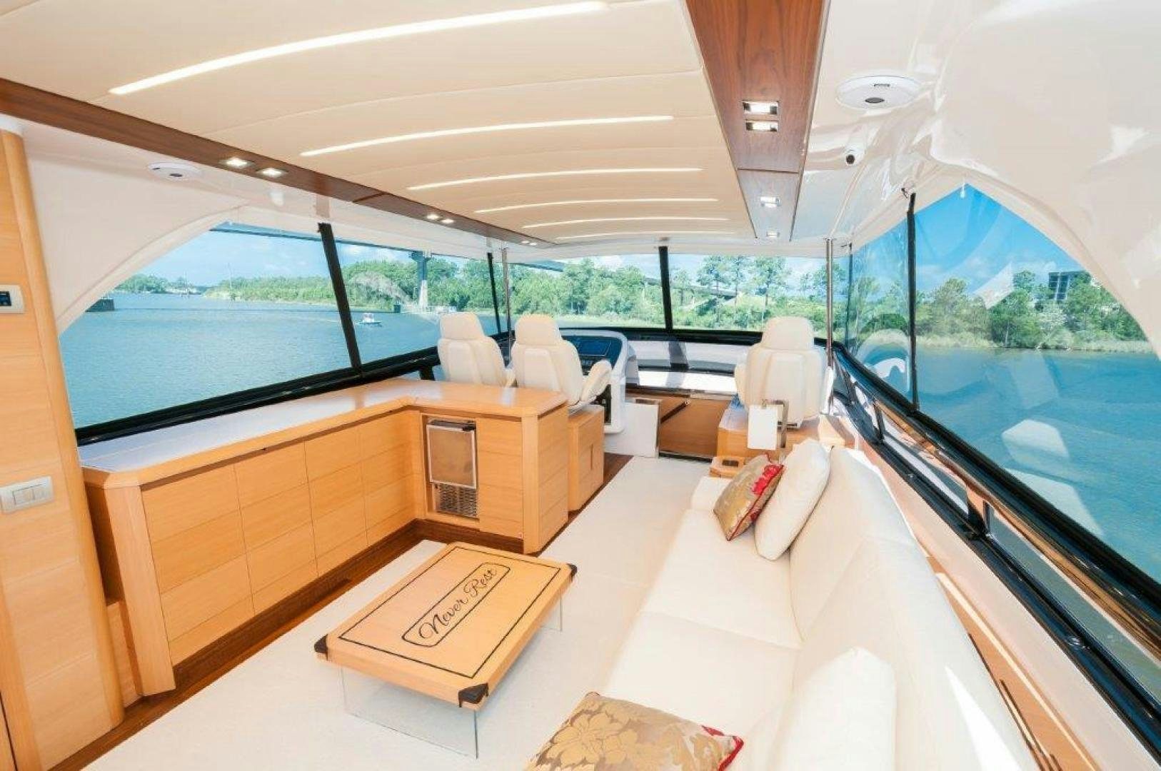 a room with a bed and a table and chairs aboard NEVER REST Yacht for Sale
