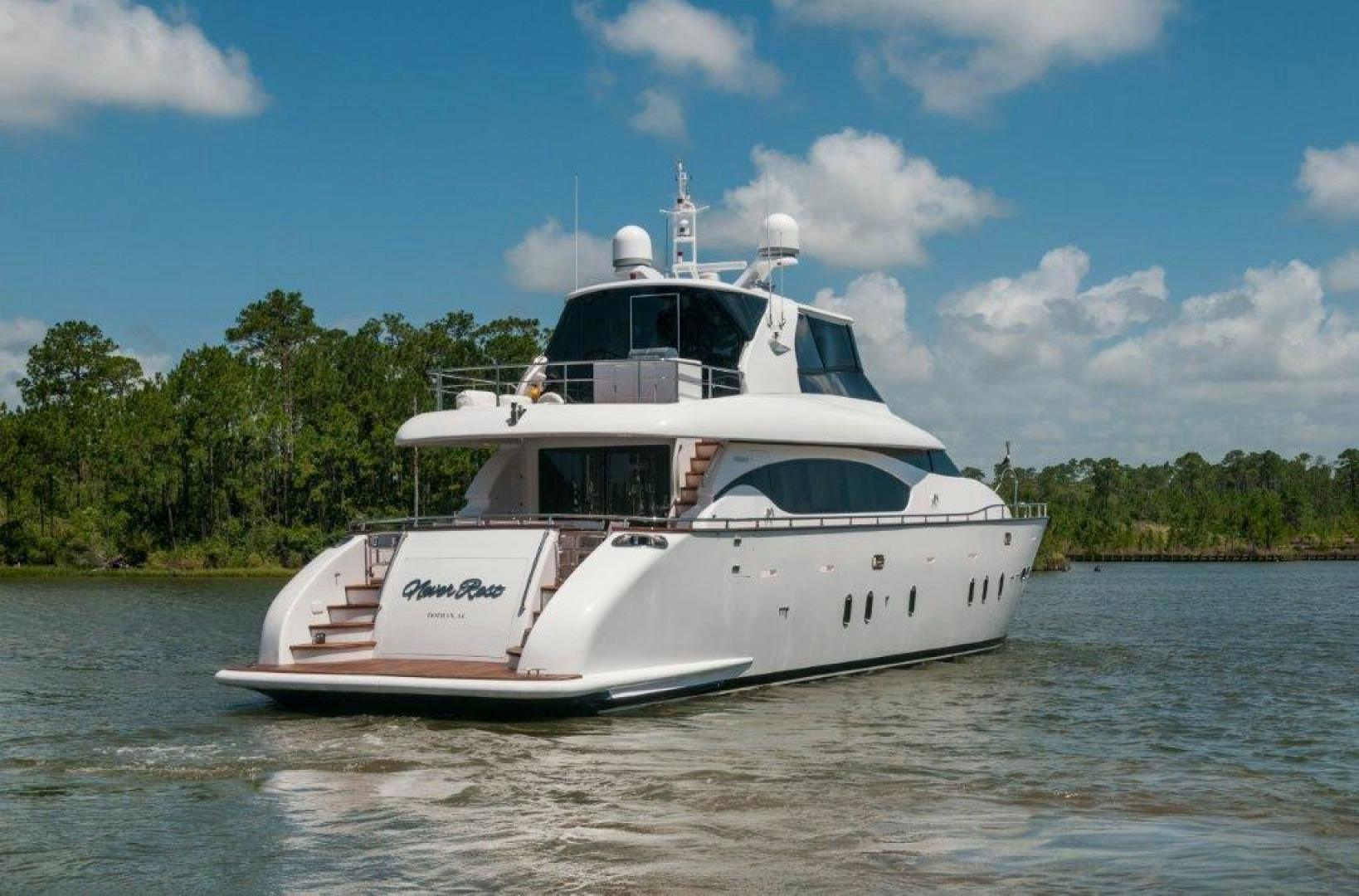 a white boat on the water aboard NEVER REST Yacht for Sale