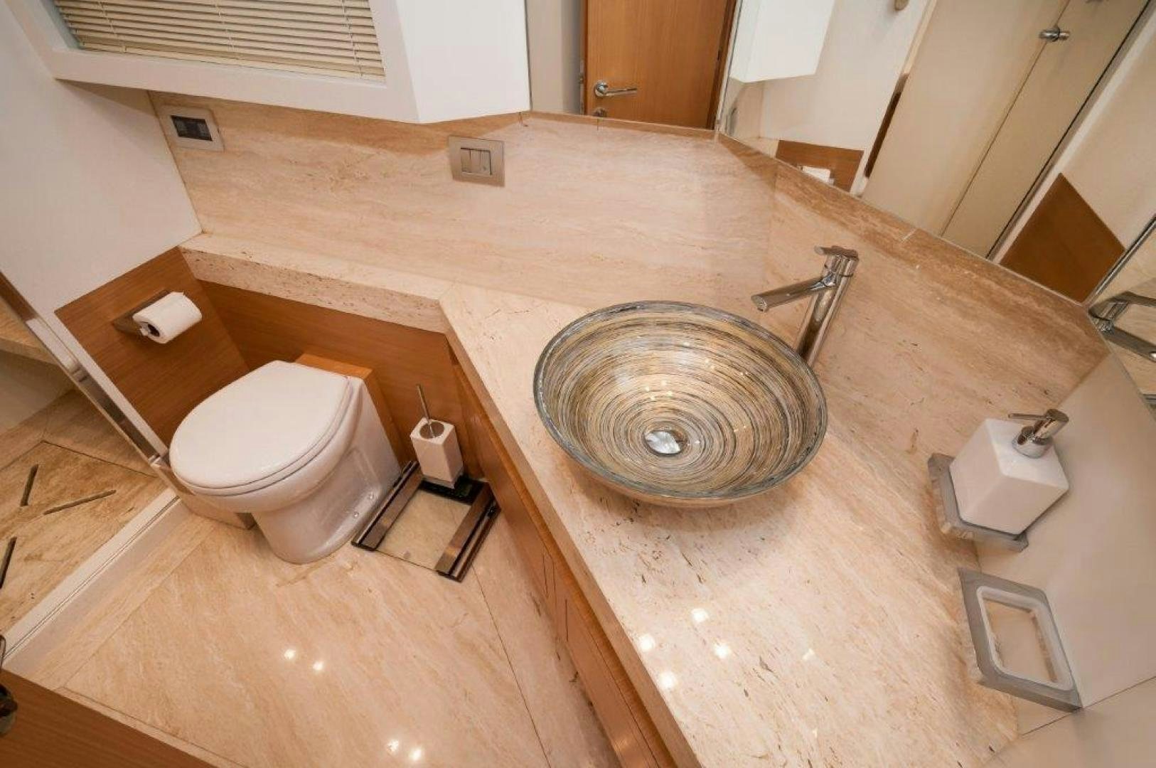 a sink and toilet in a bathroom aboard NEVER REST Yacht for Sale