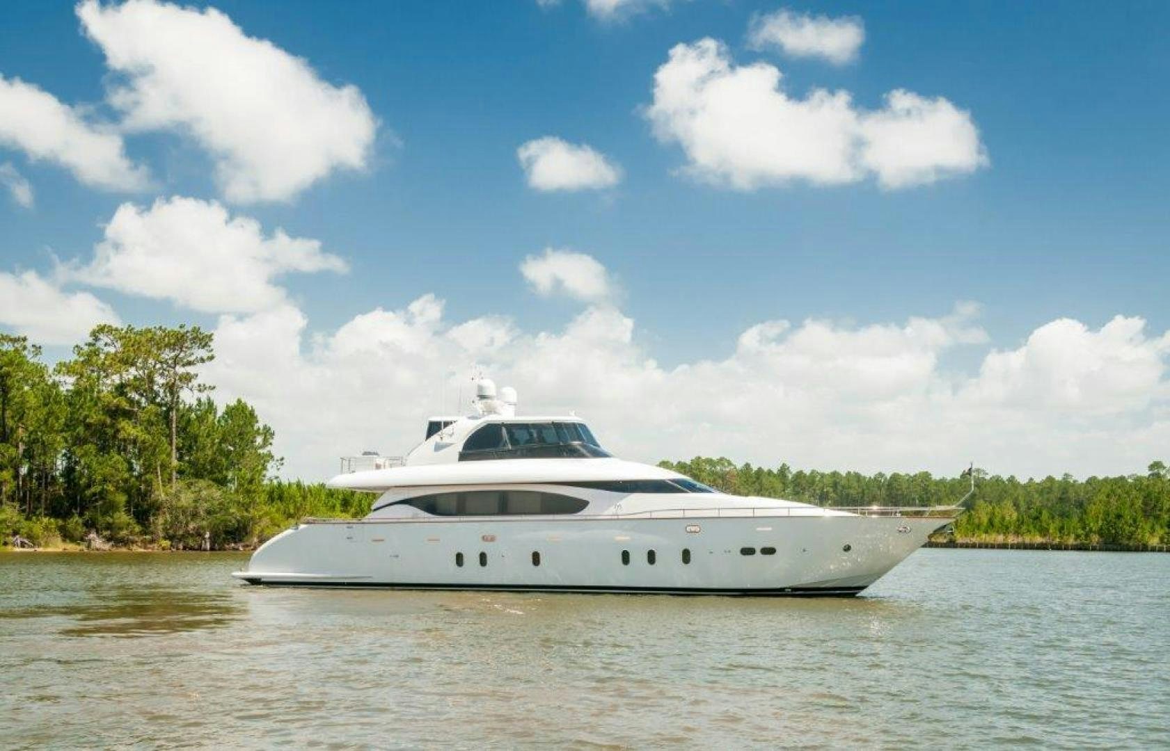 a white yacht on the water aboard NEVER REST Yacht for Sale