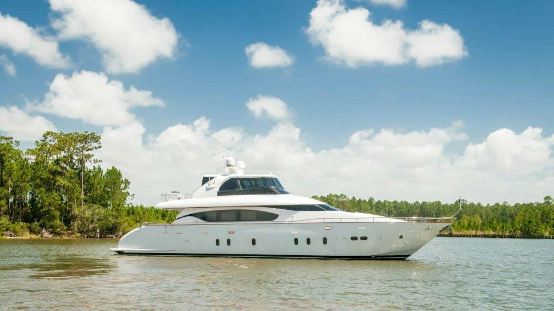 a white yacht on the water aboard NEVER REST Yacht for Sale