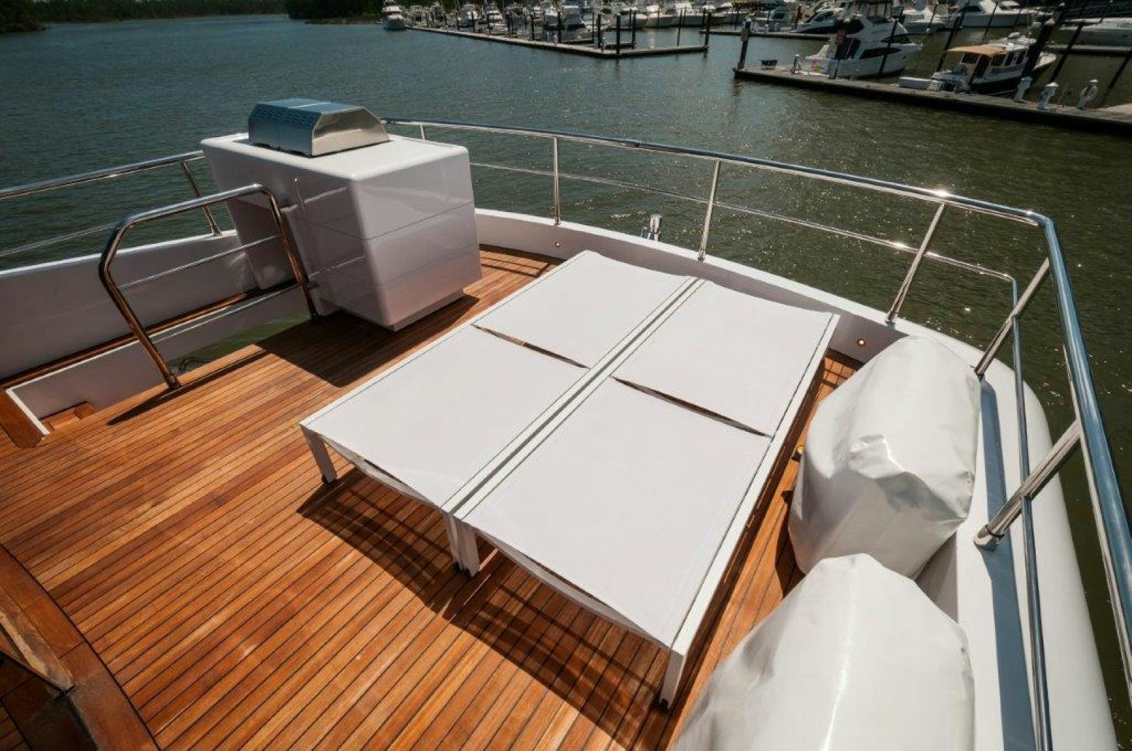 a deck with a deck and a deck with a boat on it aboard NEVER REST Yacht for Sale