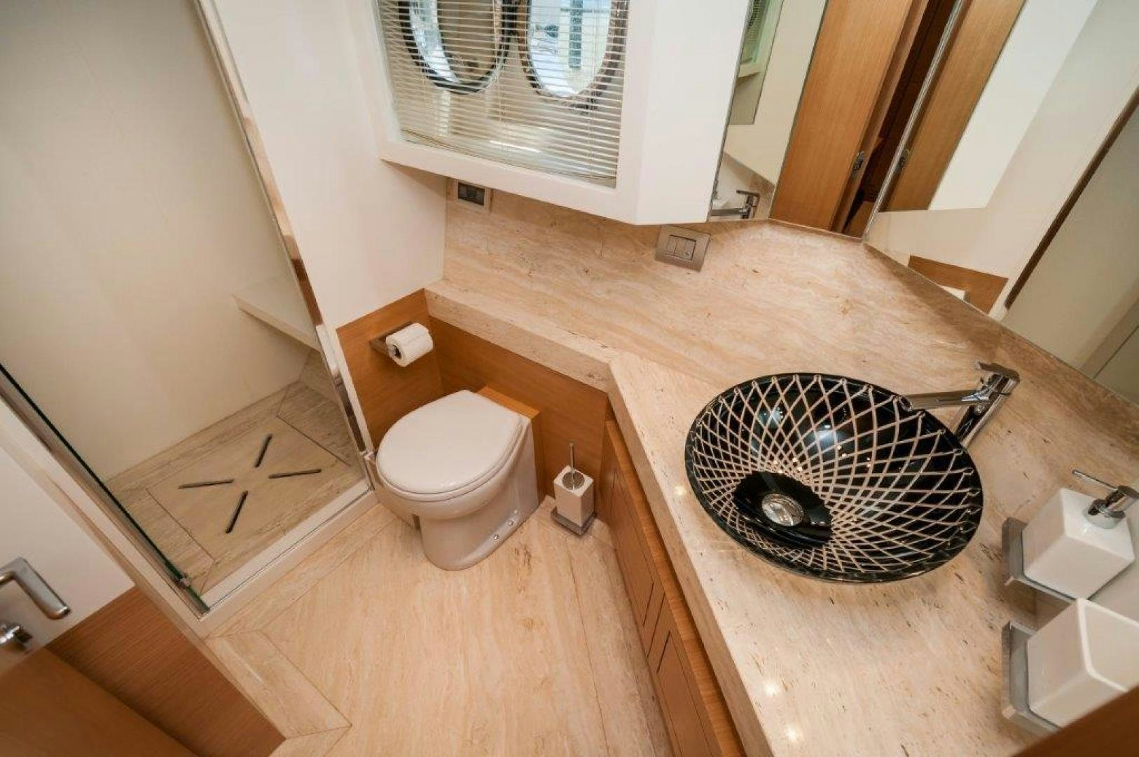 a bathroom with a round sink aboard NEVER REST Yacht for Sale