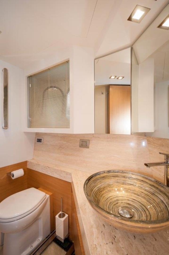 a bathroom with a sink and toilet aboard NEVER REST Yacht for Sale