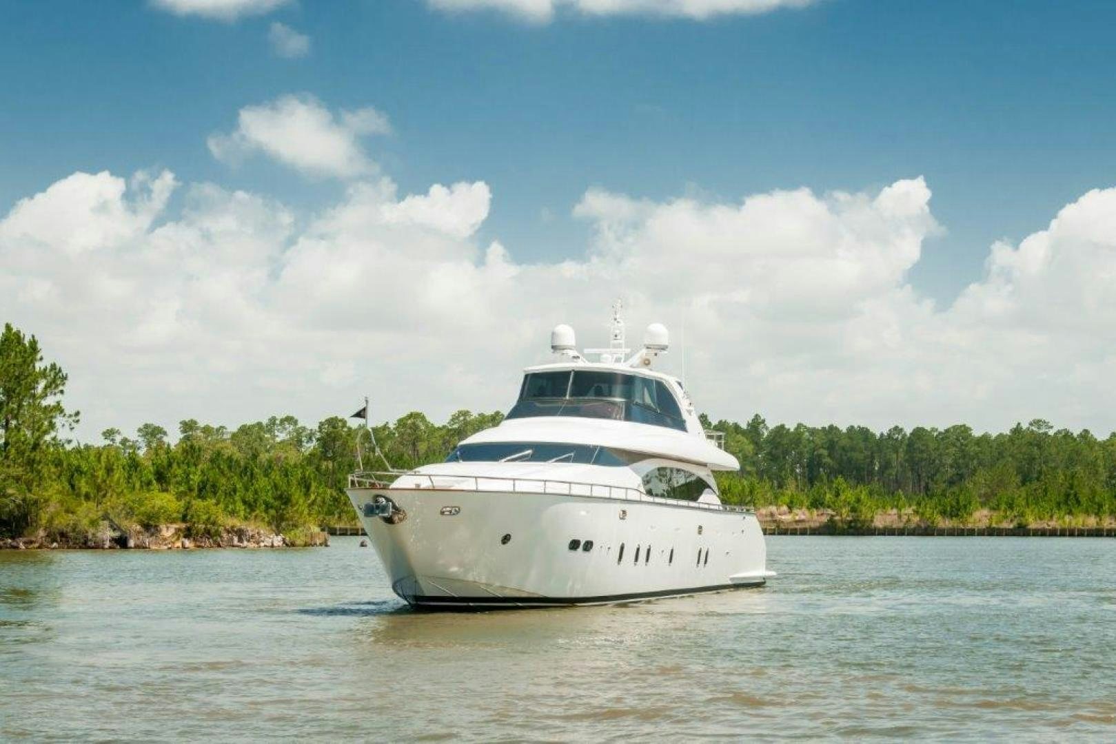 a white boat on the water aboard NEVER REST Yacht for Sale