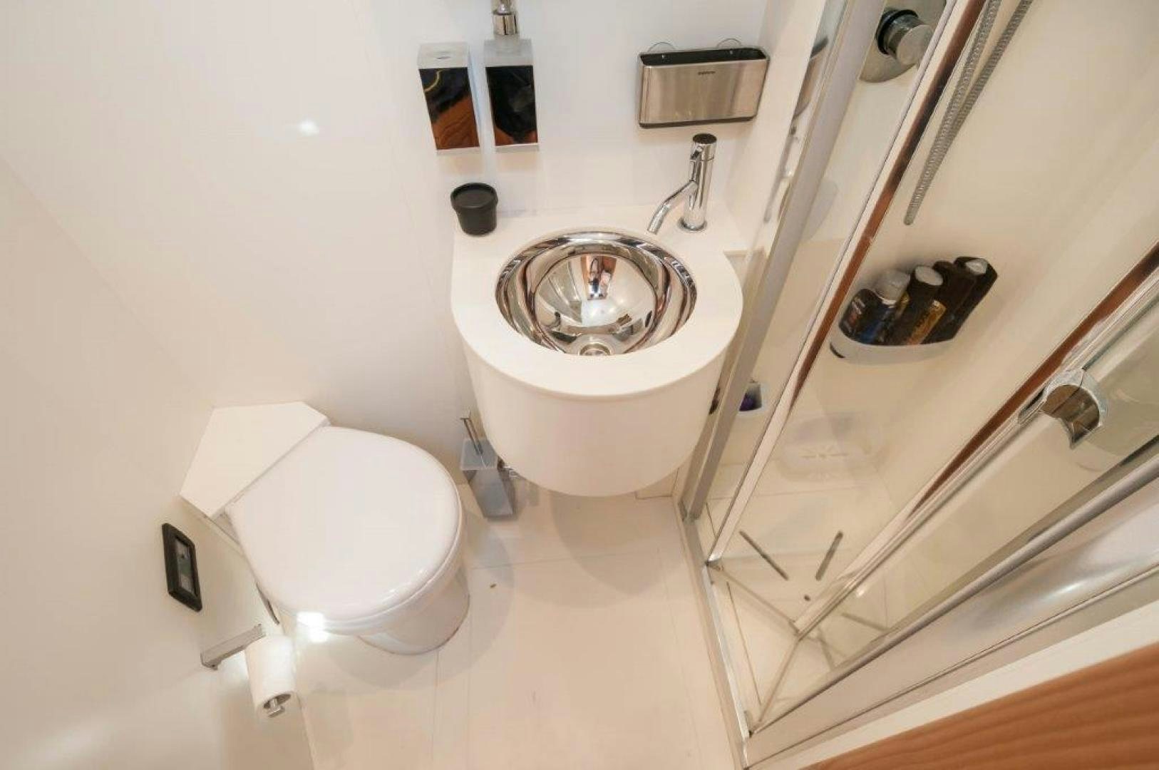 a bathroom with a sink and toilet aboard NEVER REST Yacht for Sale