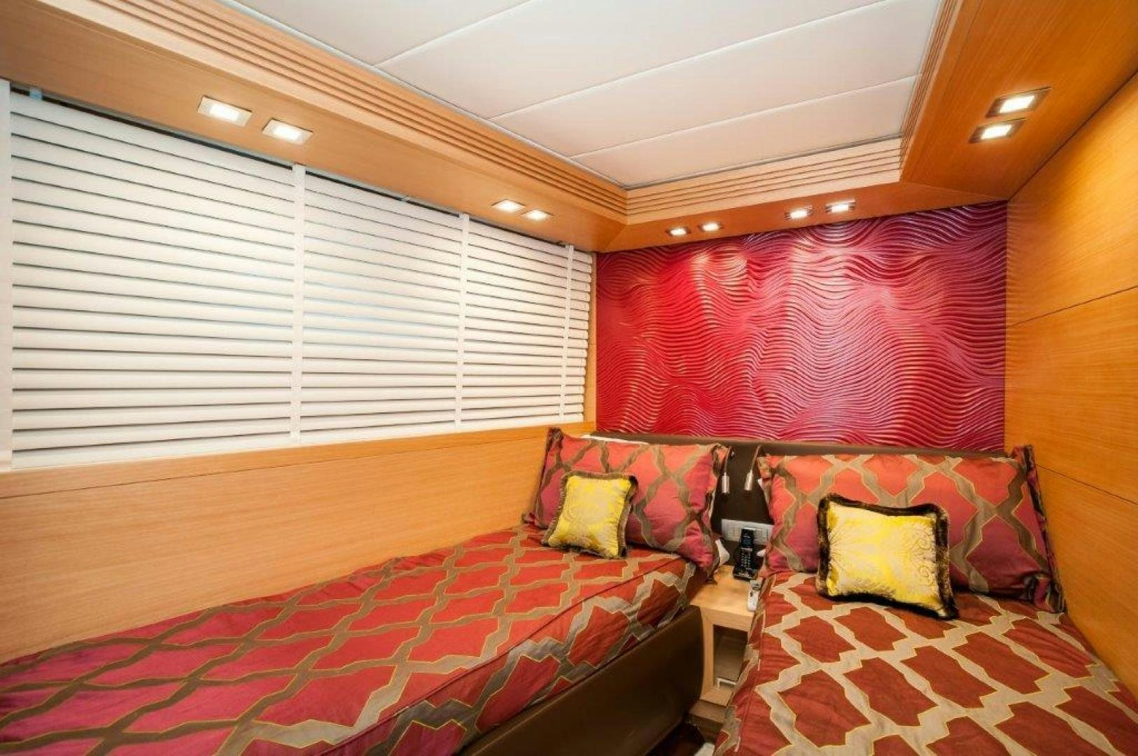 a room with a bed and a window aboard NEVER REST Yacht for Sale