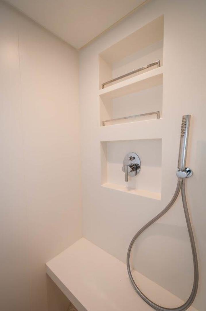 a shower unit in a white wall aboard NEVER REST Yacht for Sale