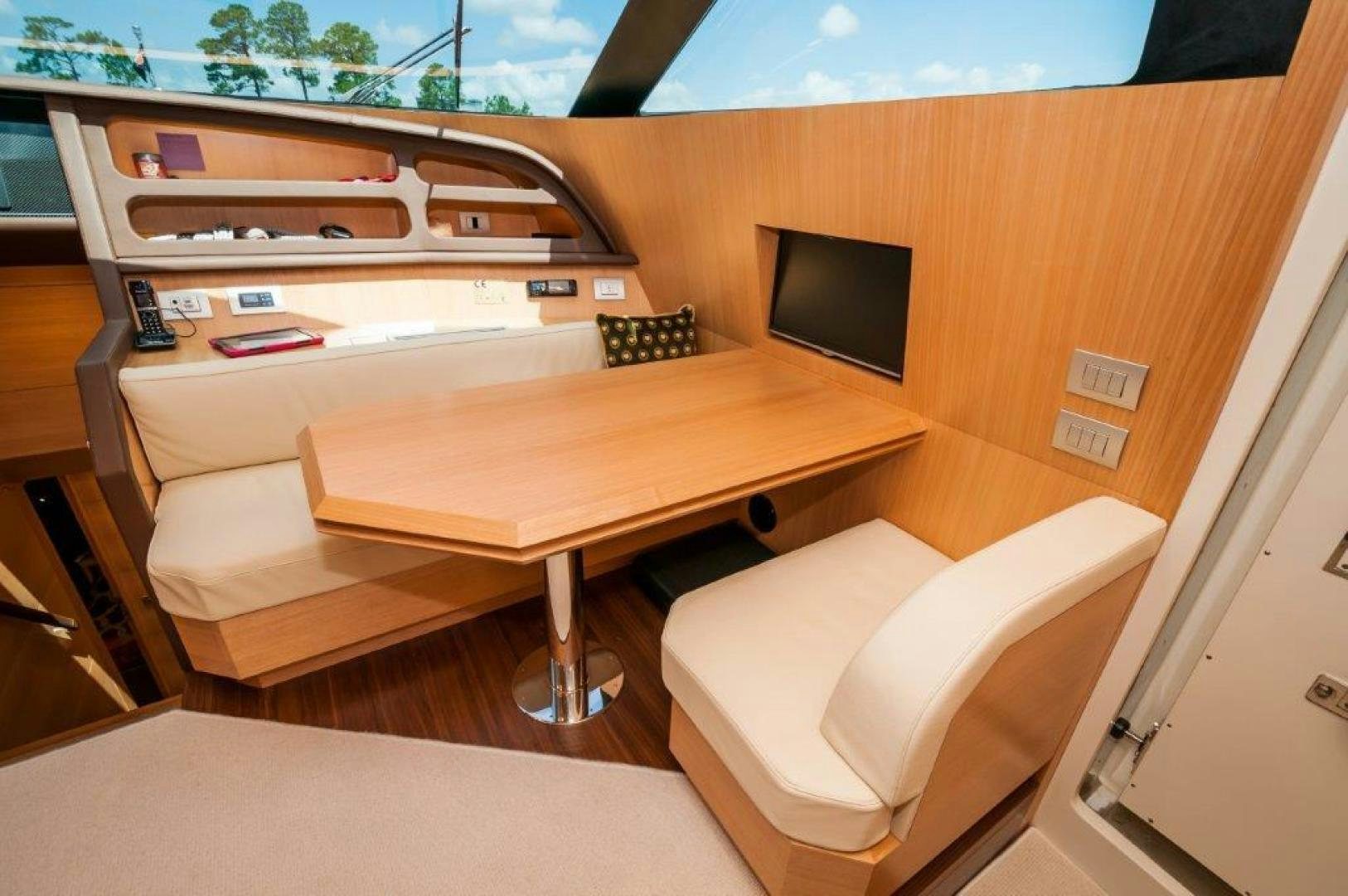 a room with a desk and a tv aboard NEVER REST Yacht for Sale