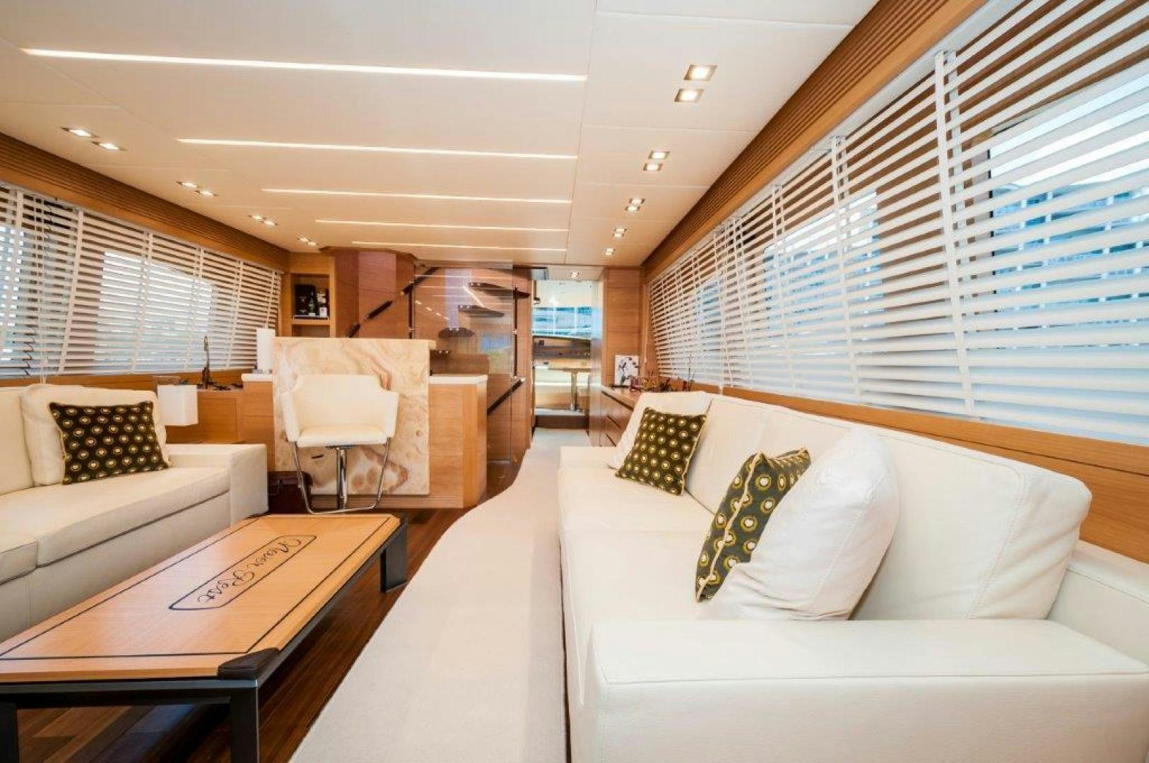 a room with a bed and a table aboard NEVER REST Yacht for Sale