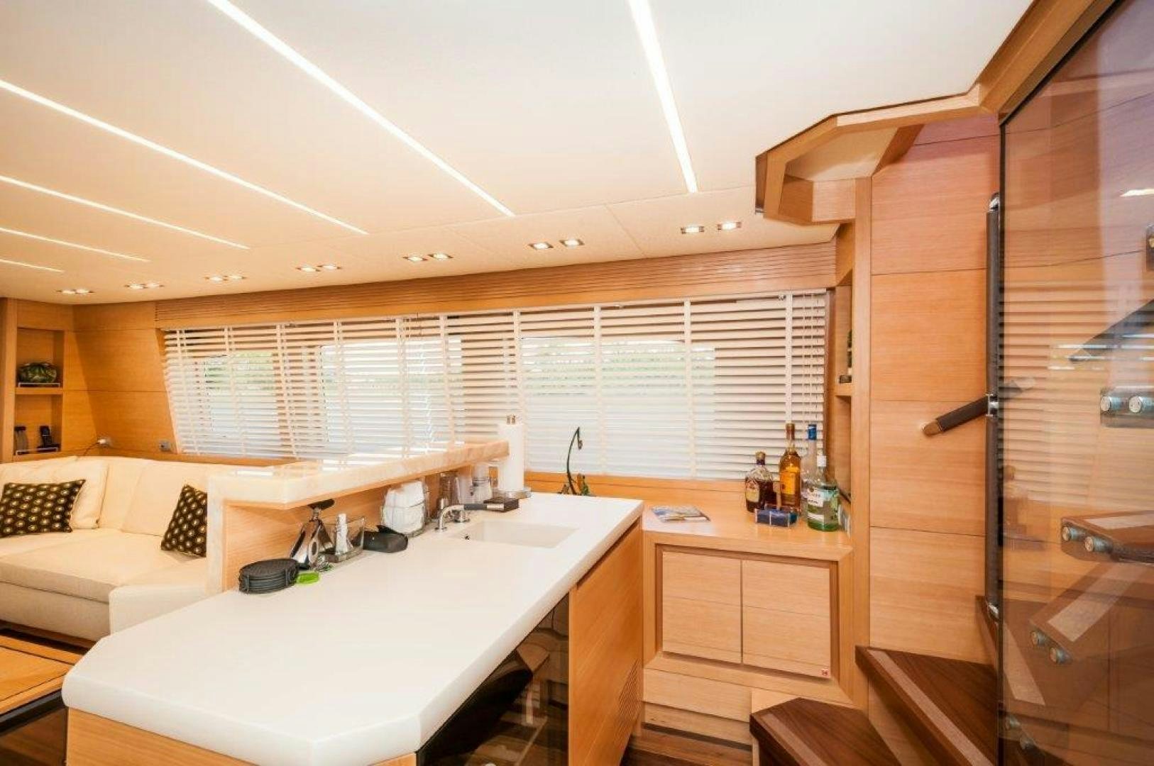 a kitchen with a sink and a bed aboard NEVER REST Yacht for Sale