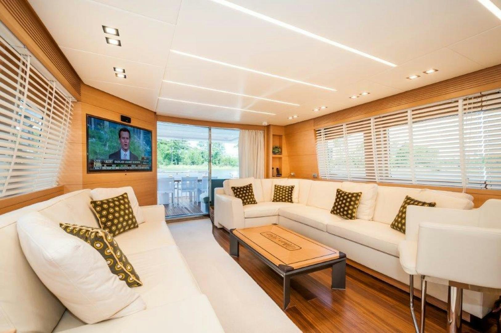 a living room with a couch and a coffee table aboard NEVER REST Yacht for Sale