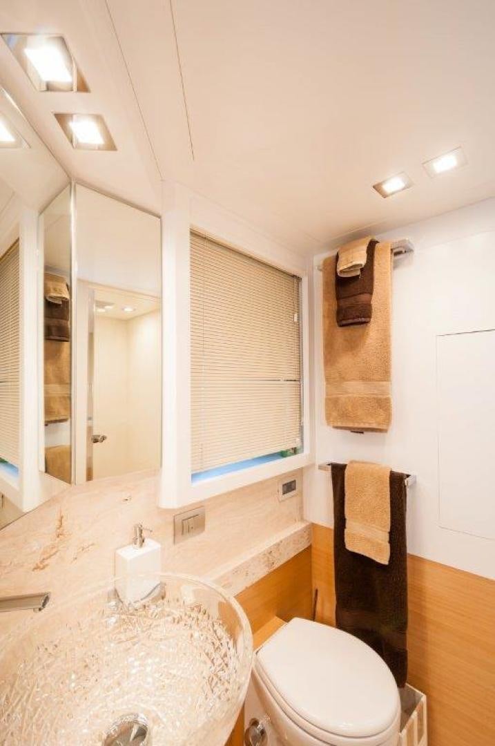 a bathroom with a sink and a toilet aboard NEVER REST Yacht for Sale
