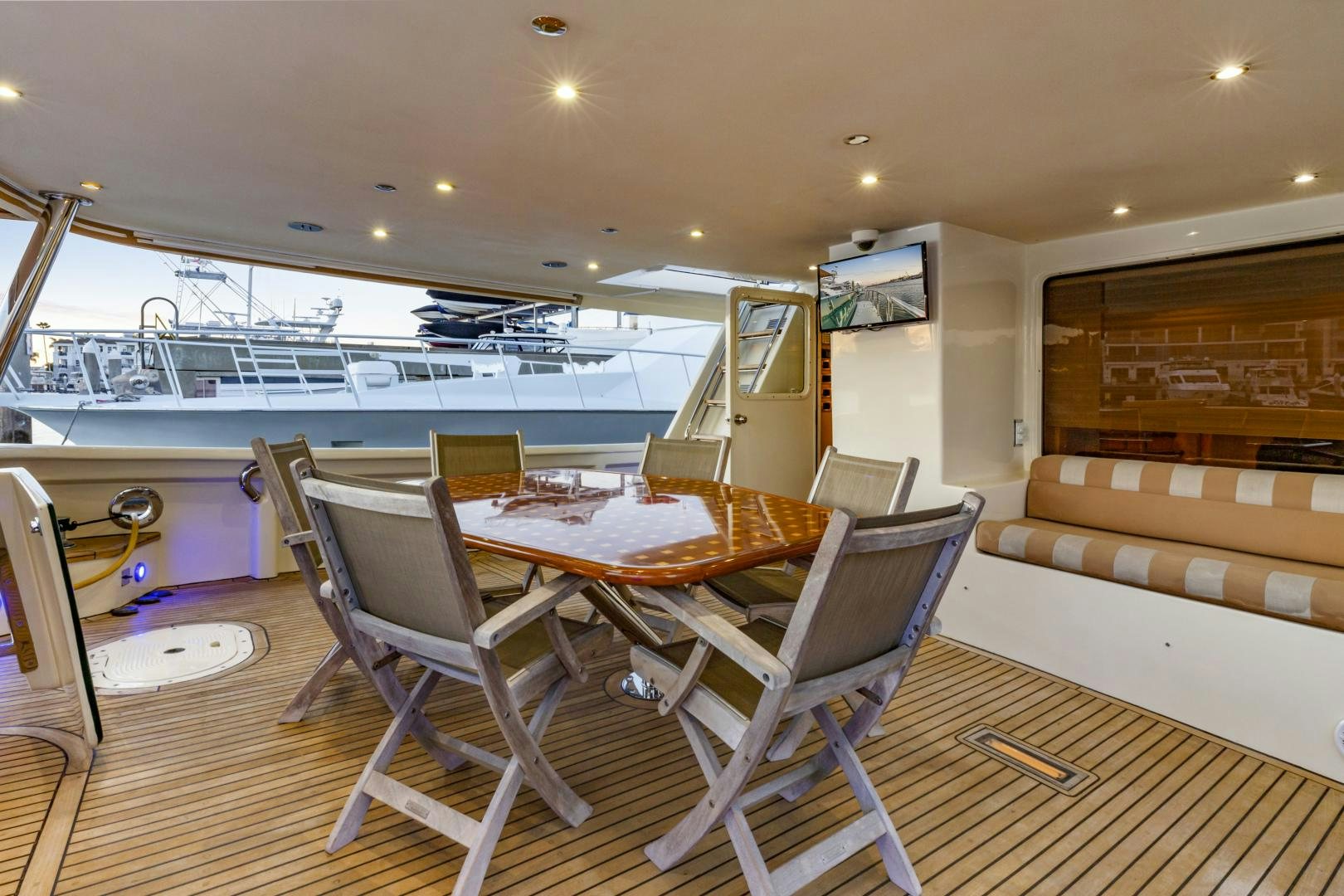 a room with a table and chairs aboard HOLIDAY Yacht for Sale