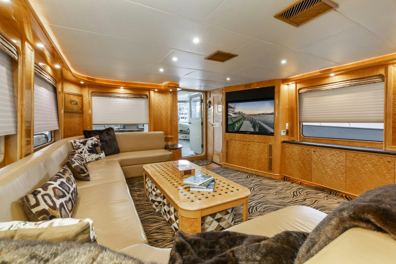 a living room with a large window aboard HOLIDAY Yacht for Sale