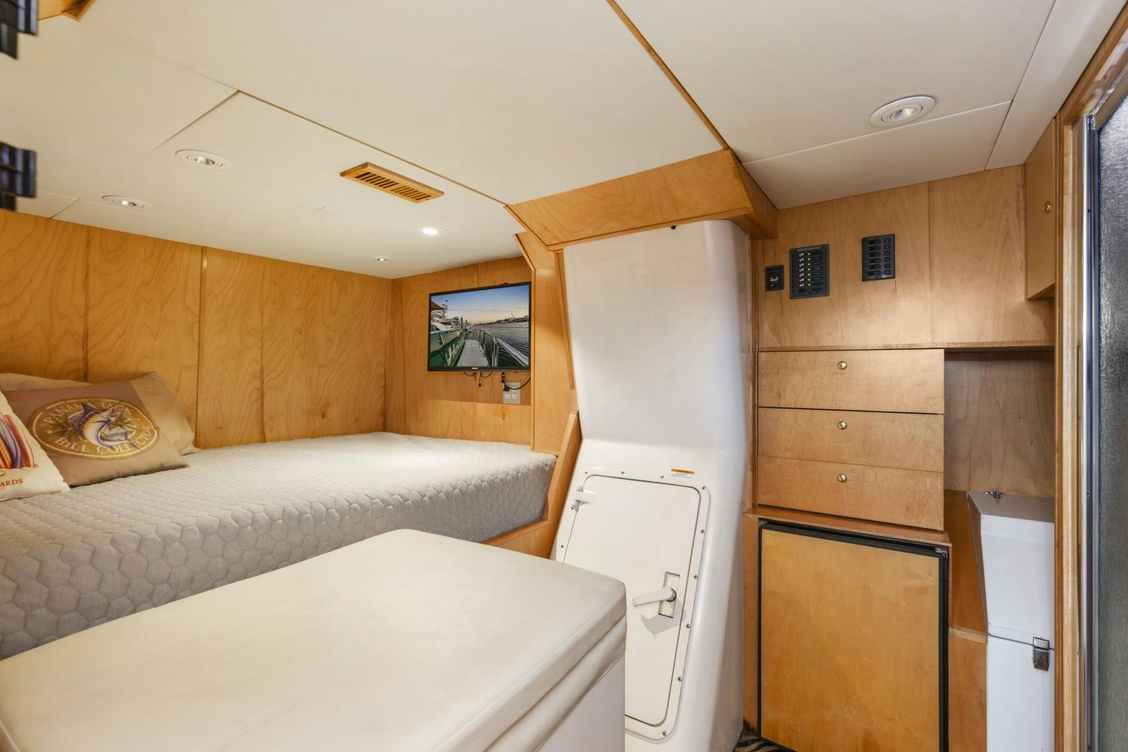 a room with a bed and a closet aboard HOLIDAY Yacht for Sale
