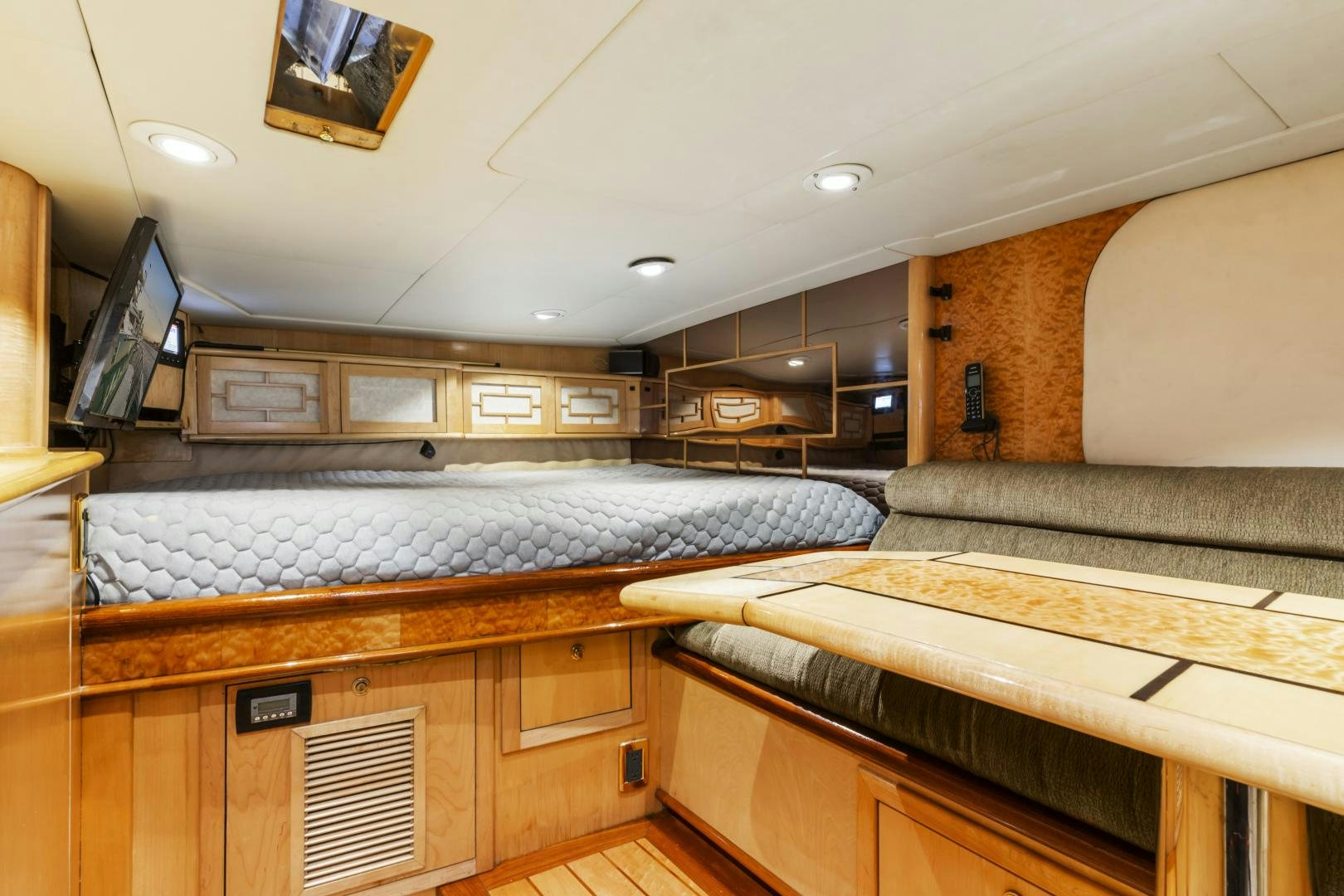 a large kitchen with a large bed aboard HOLIDAY Yacht for Sale