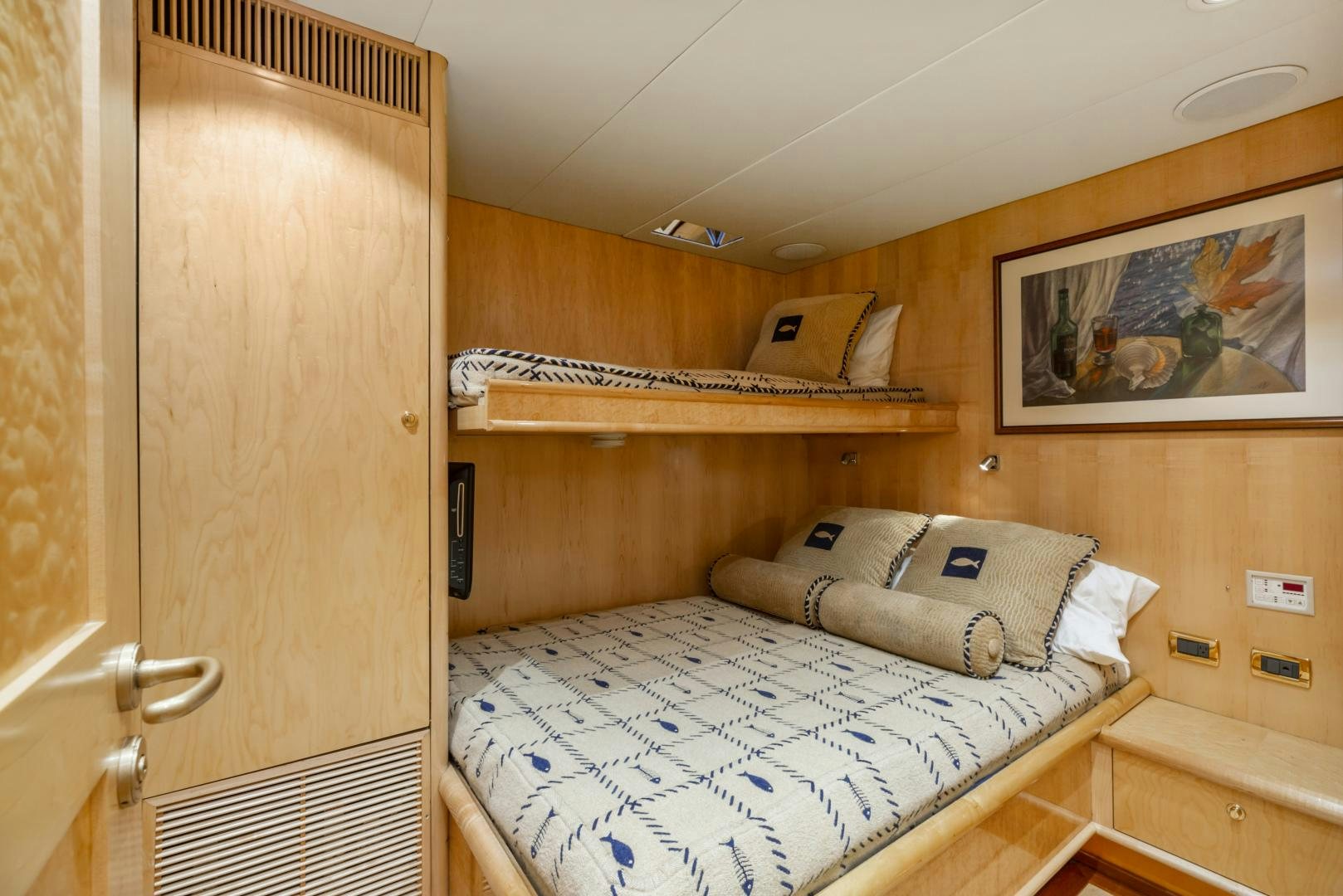 a room with a bed and a closet aboard HOLIDAY Yacht for Sale