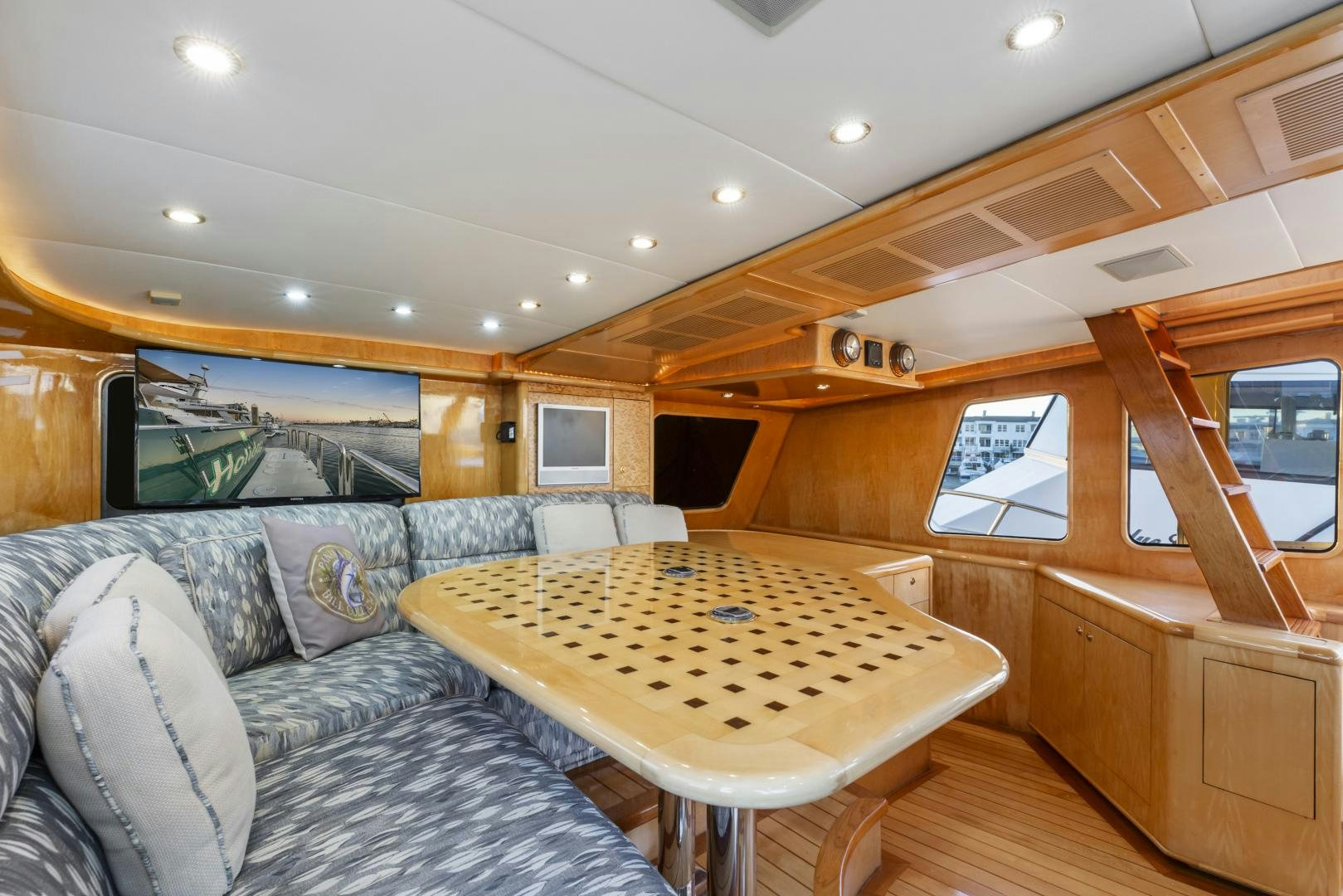 a living room with a couch and a table aboard HOLIDAY Yacht for Sale