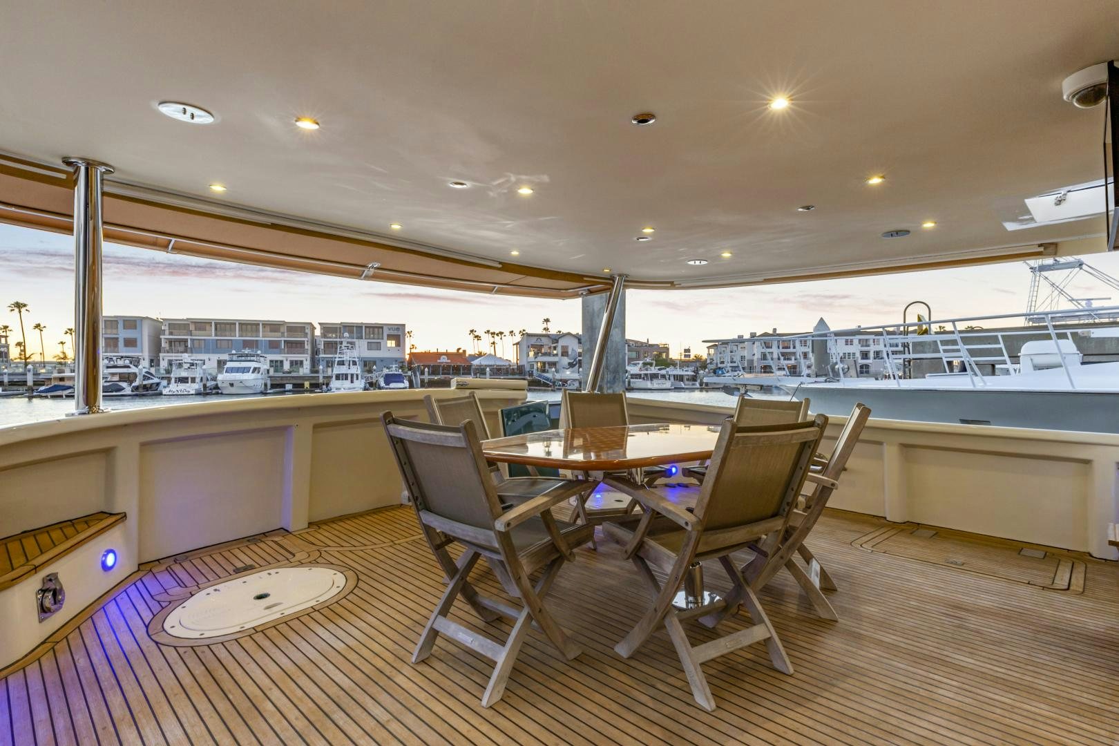 a room with tables and chairs aboard HOLIDAY Yacht for Sale