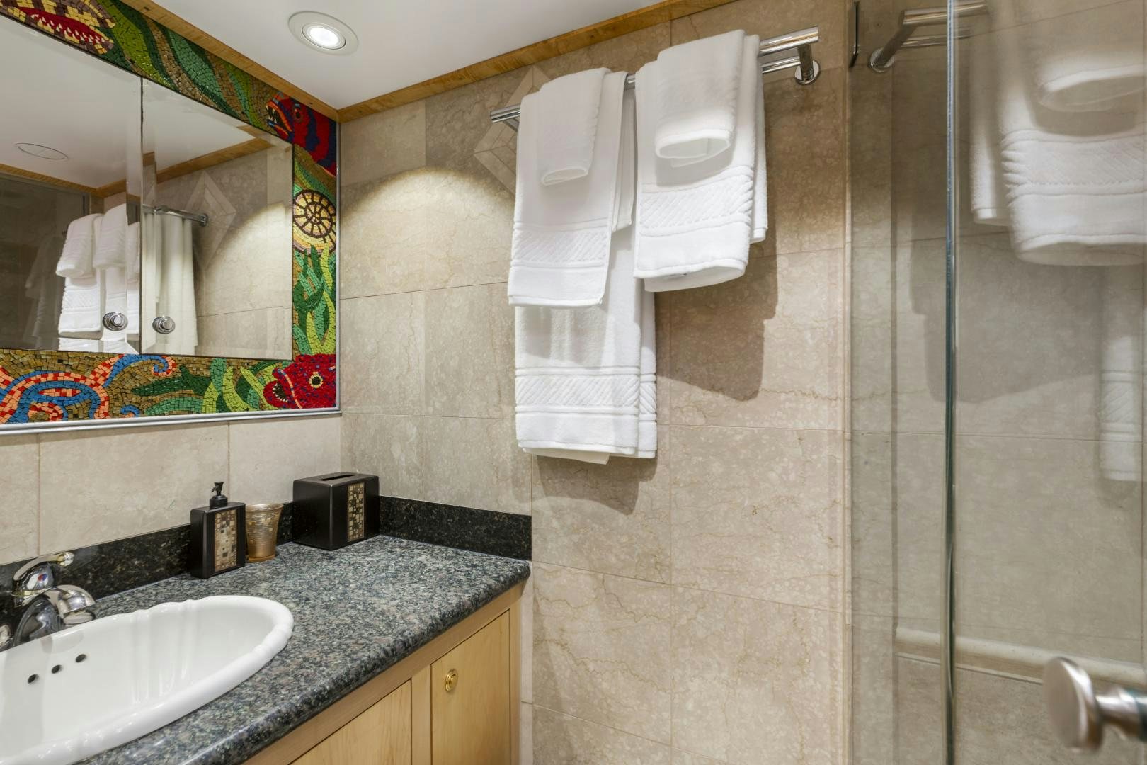 a bathroom with a shower and sink aboard HOLIDAY Yacht for Sale