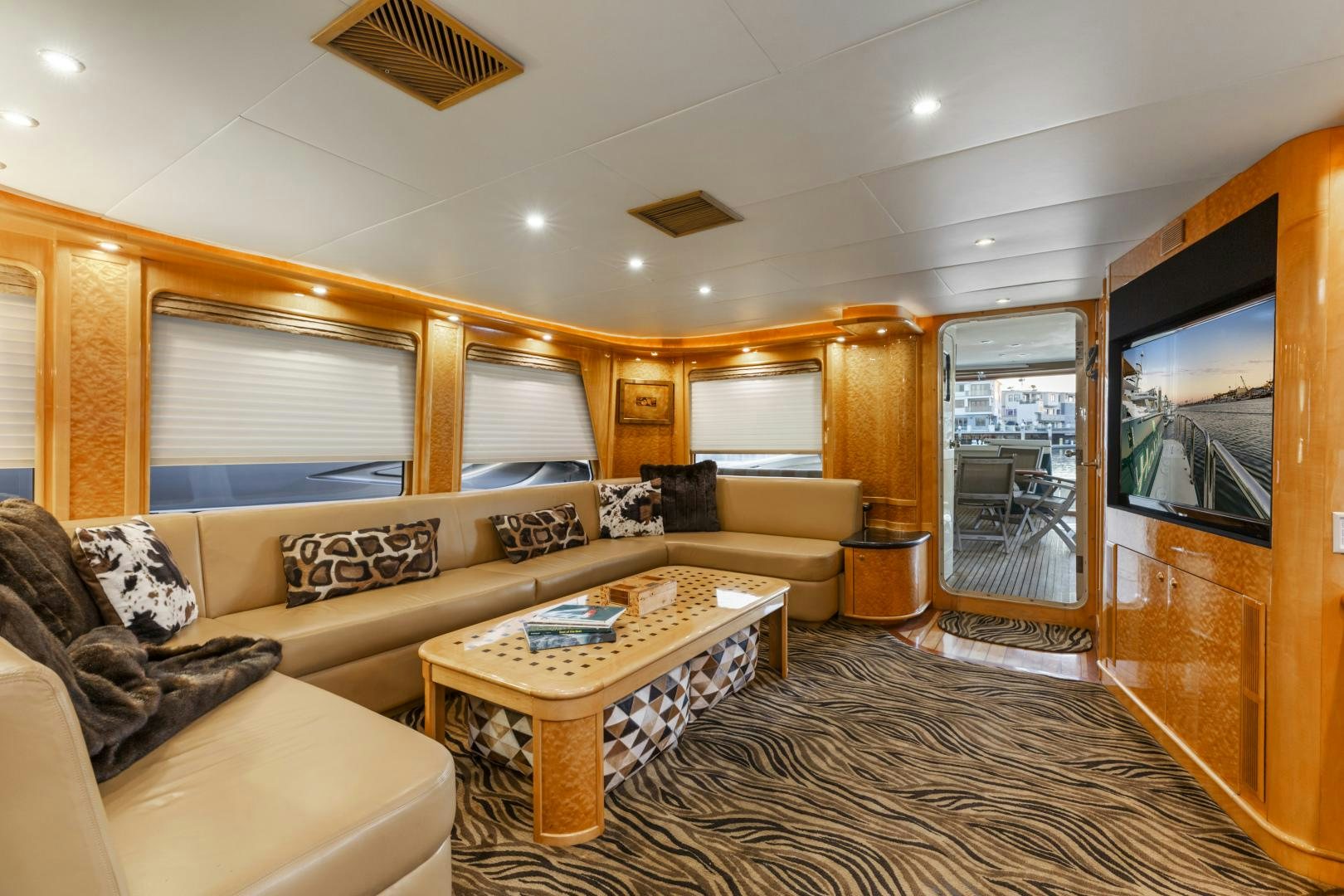 a living room with a large mirror aboard HOLIDAY Yacht for Sale