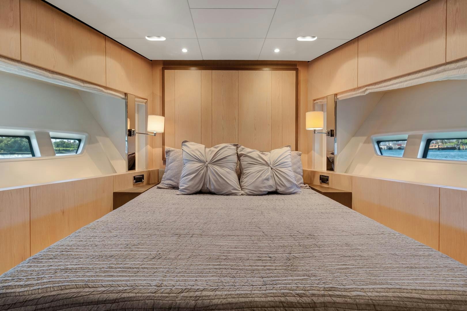 a bed with a white comforter aboard NO NAME Yacht for Sale