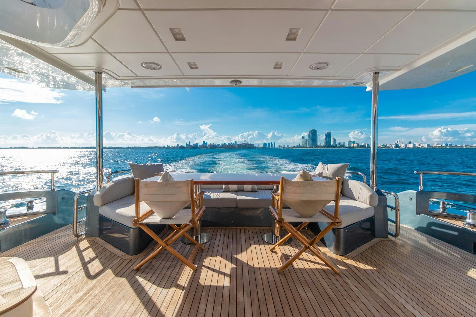 a deck with chairs and a view of a city aboard NO NAME Yacht for Sale