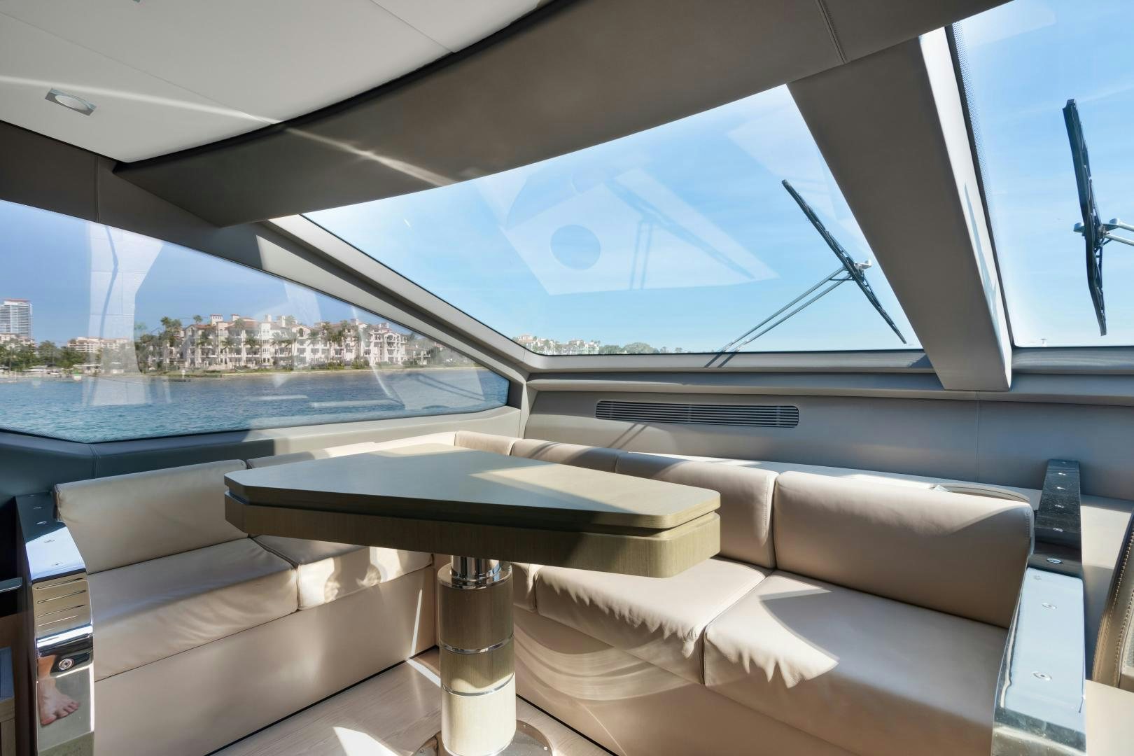 a room with a table and a window with a view of a city aboard NO NAME Yacht for Sale