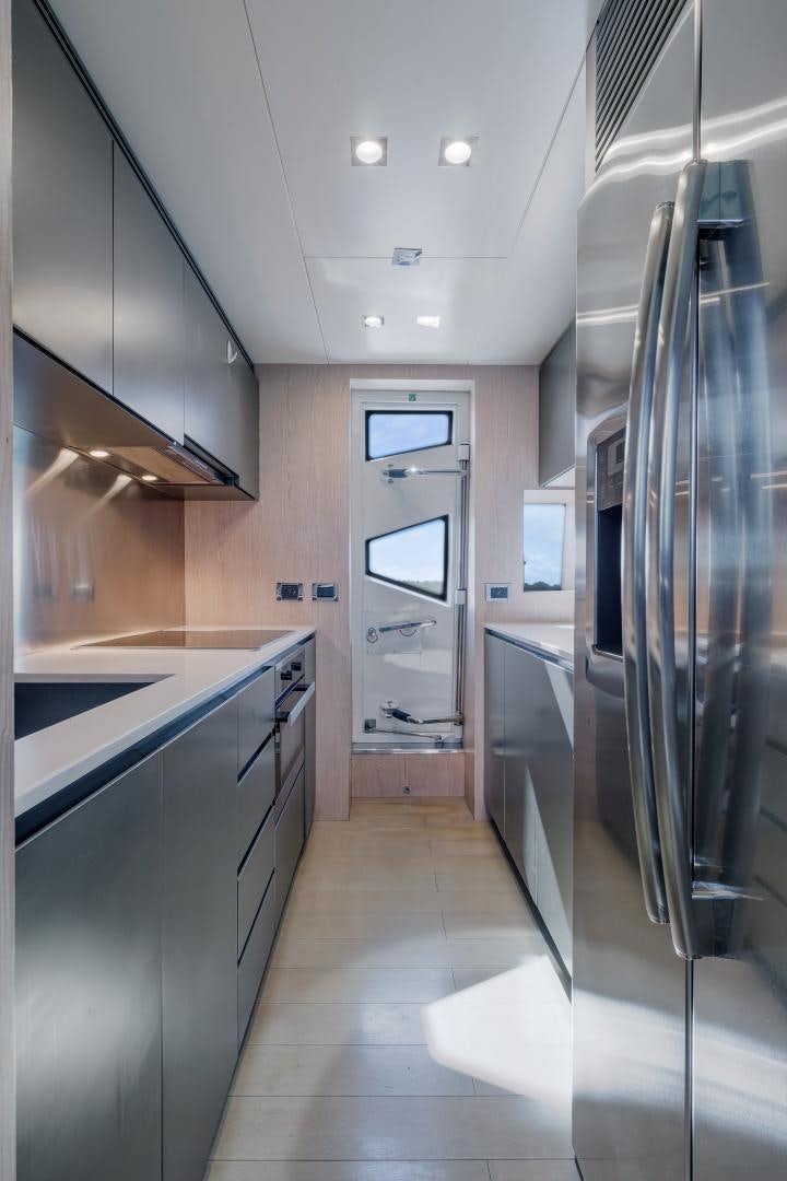 a kitchen with stainless steel appliances aboard NO NAME Yacht for Sale