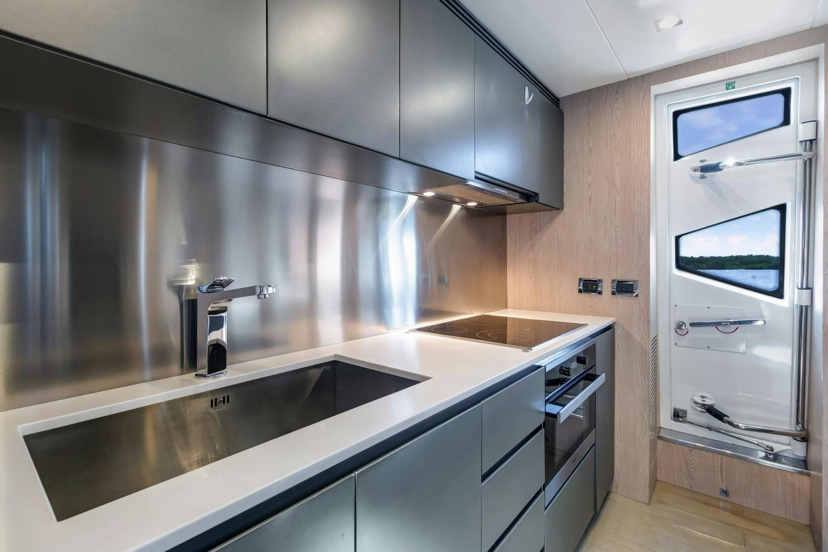 a kitchen with stainless steel appliances aboard NO NAME Yacht for Sale