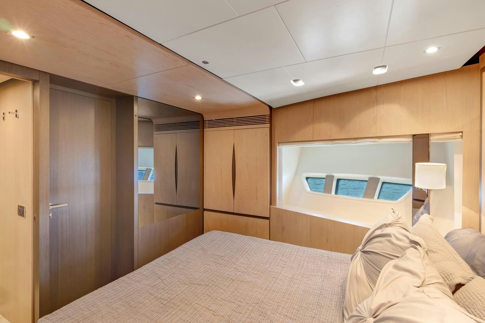 a bedroom with a bed and a desk aboard NO NAME Yacht for Sale