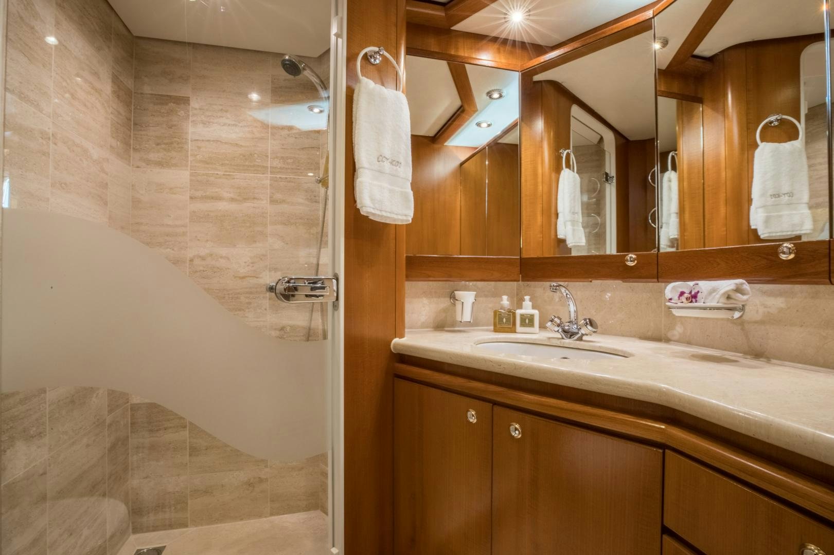 a bathroom with a sink and a shower aboard SLOW POKE Yacht for Sale