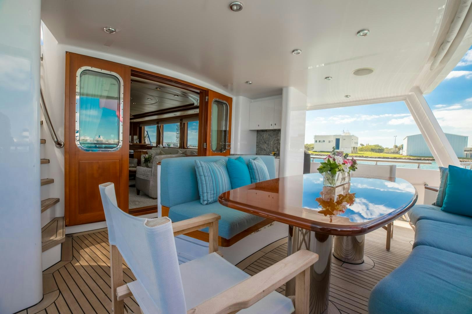 a room with a table and chairs aboard SLOW POKE Yacht for Sale