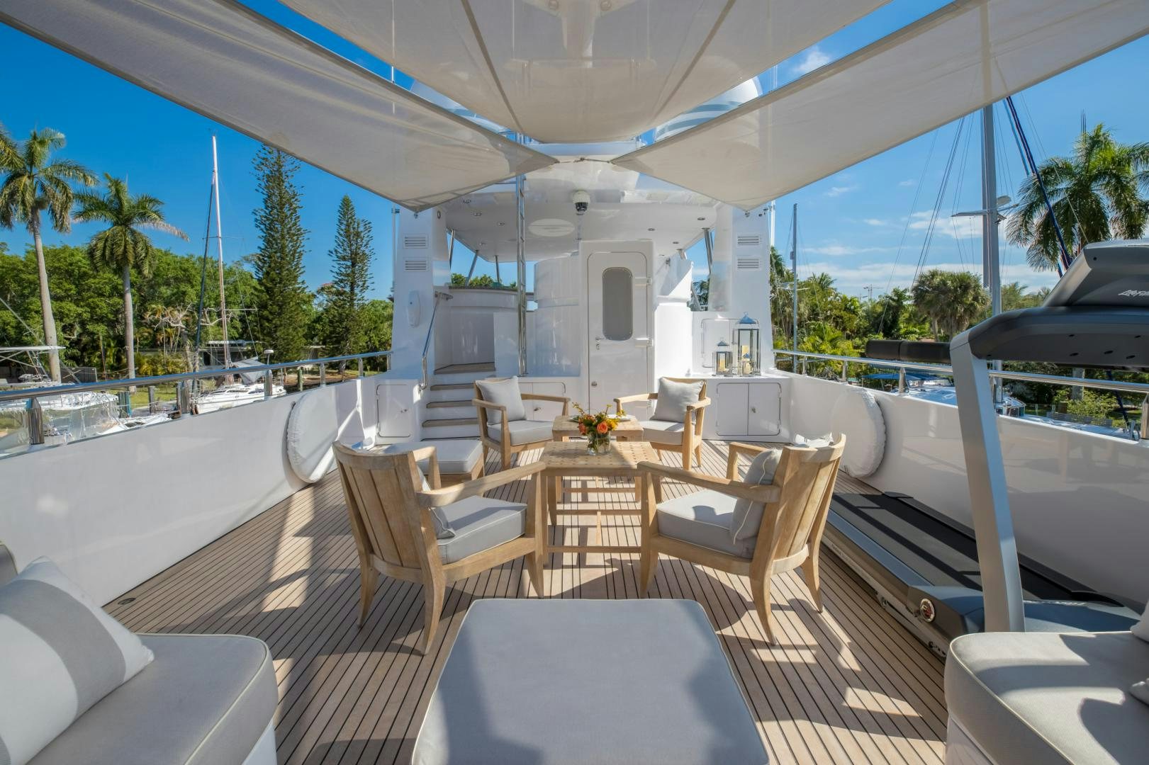 a patio with a table and chairs aboard SLOW POKE Yacht for Sale