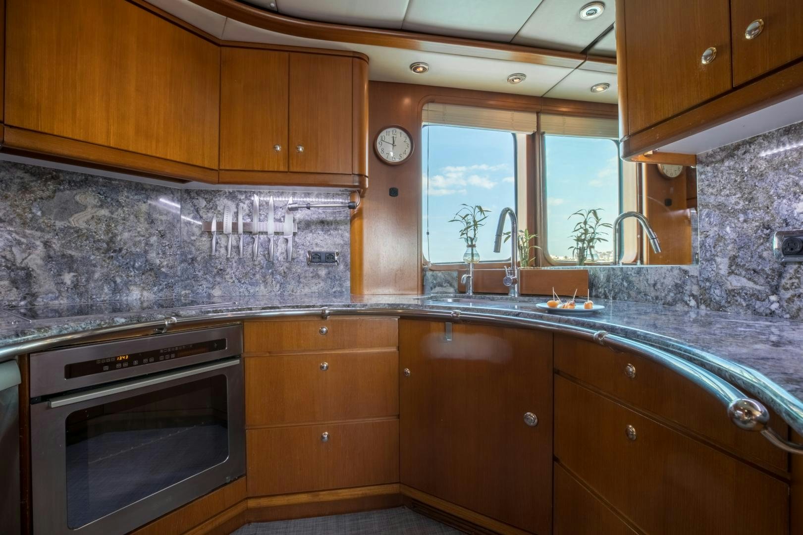 a kitchen with wooden cabinets aboard SLOW POKE Yacht for Sale
