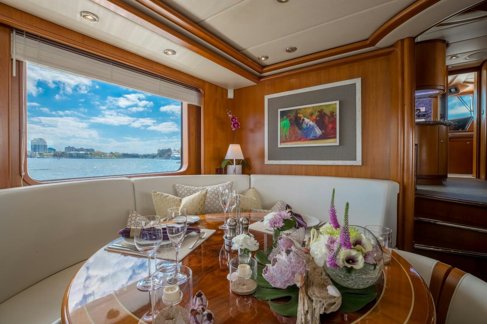 a dining room with a large window aboard SLOW POKE Yacht for Sale