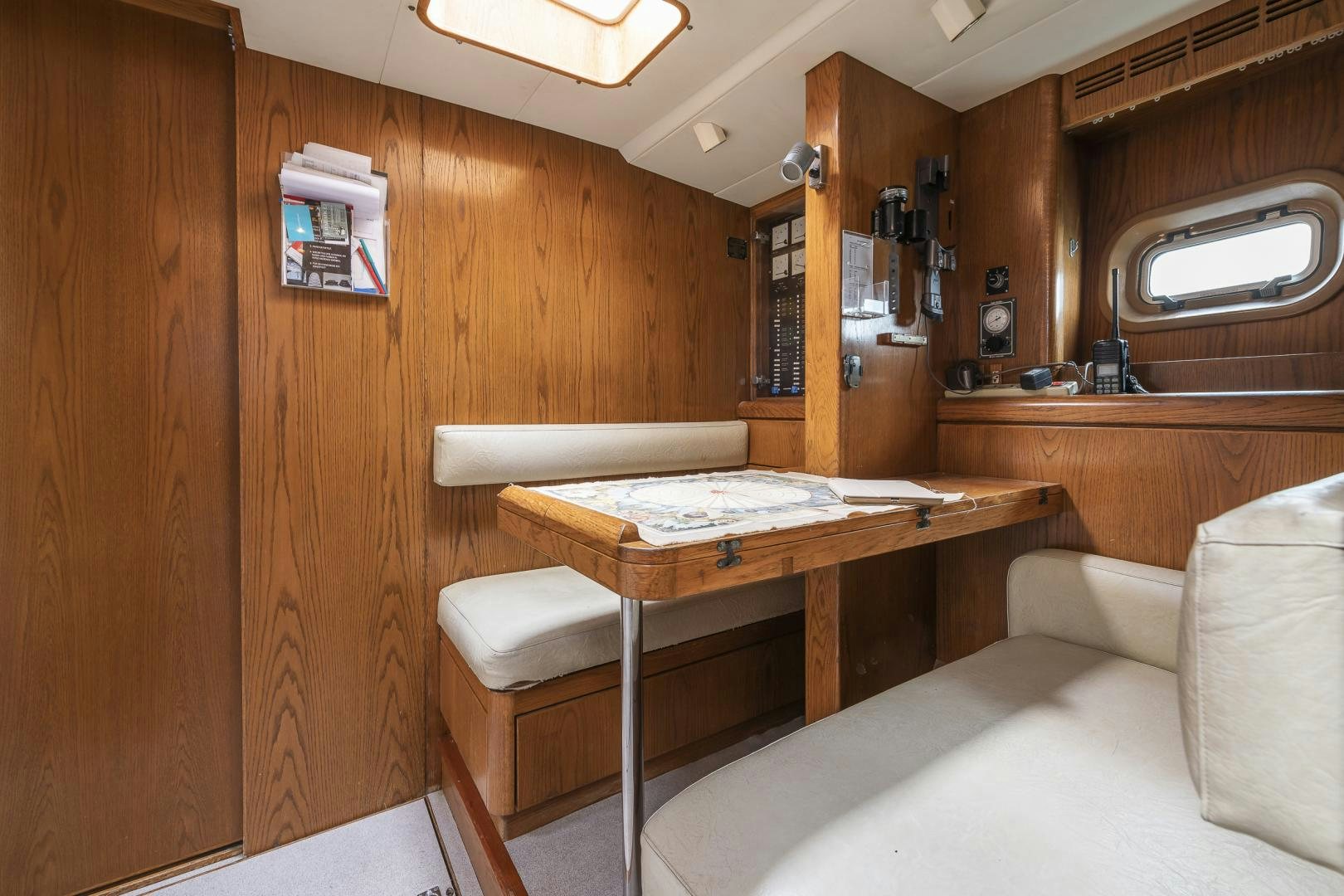 a room with a bed and desk aboard ROCIO Yacht for Sale
