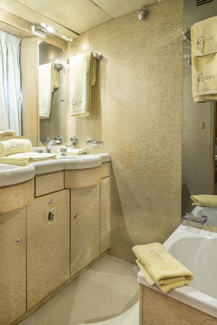 a bathroom with a shower curtain aboard ROCIO Yacht for Sale