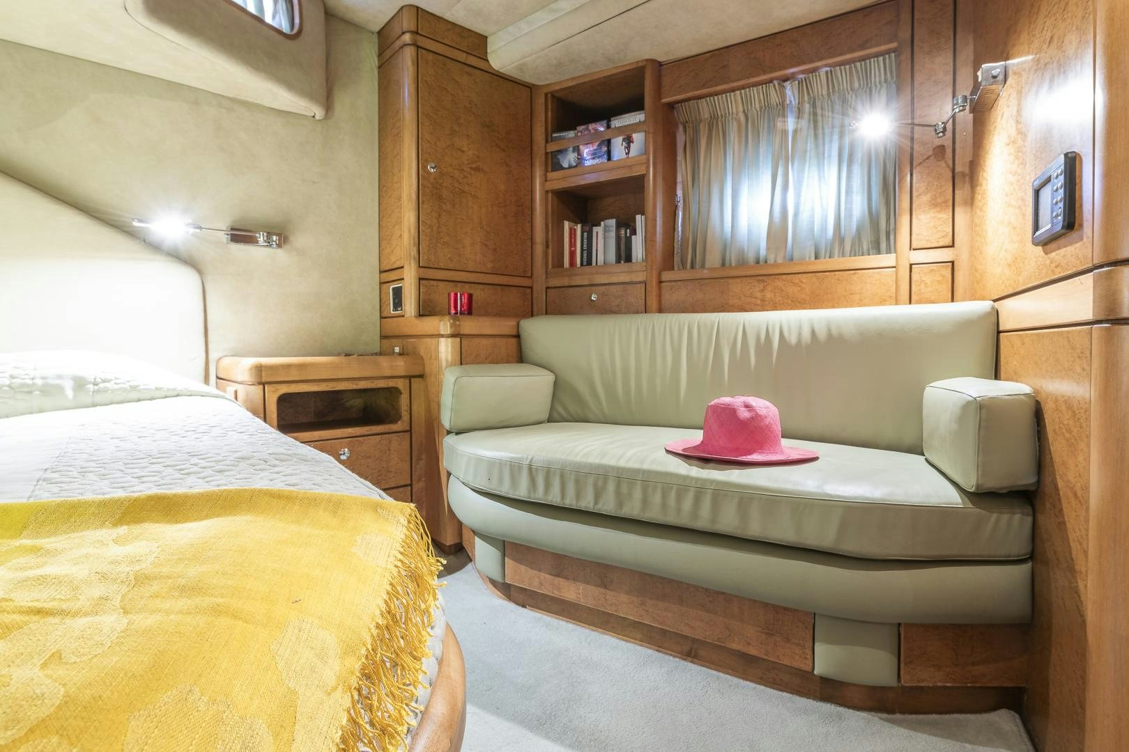 a room with a couch and a bed aboard ROCIO Yacht for Sale