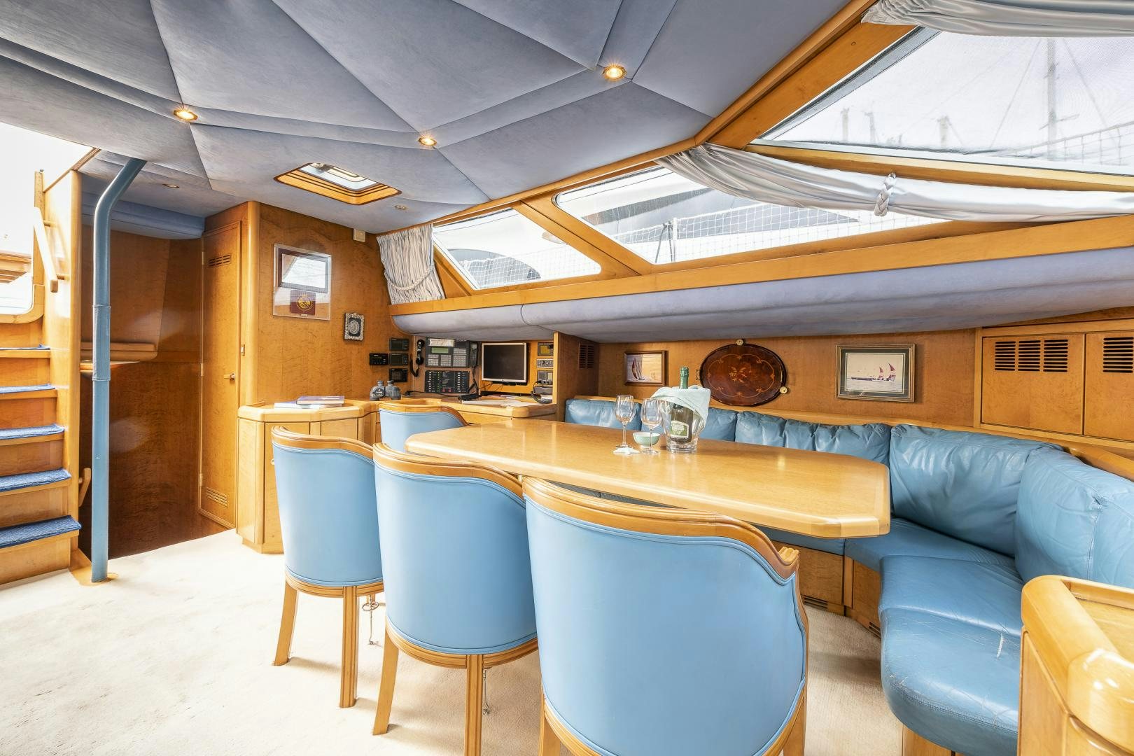 a room with a table and chairs aboard ROCIO Yacht for Sale