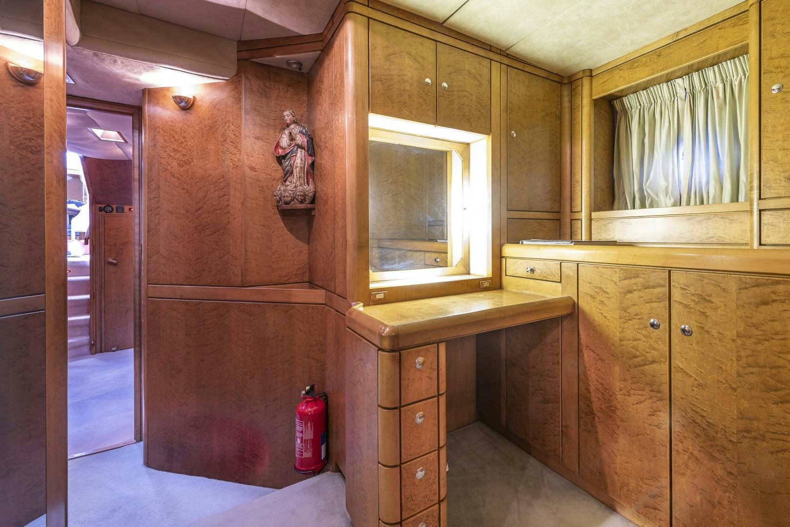 a room with wooden cabinets aboard ROCIO Yacht for Sale