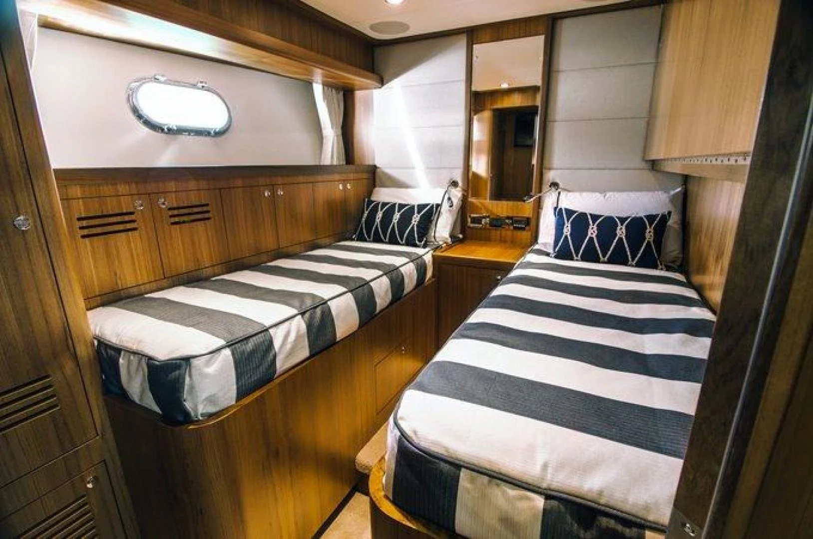 a room with bunk beds aboard JOHNSON 80' FLYBRIDGE W/FISHING COCKPIT Yacht for Sale