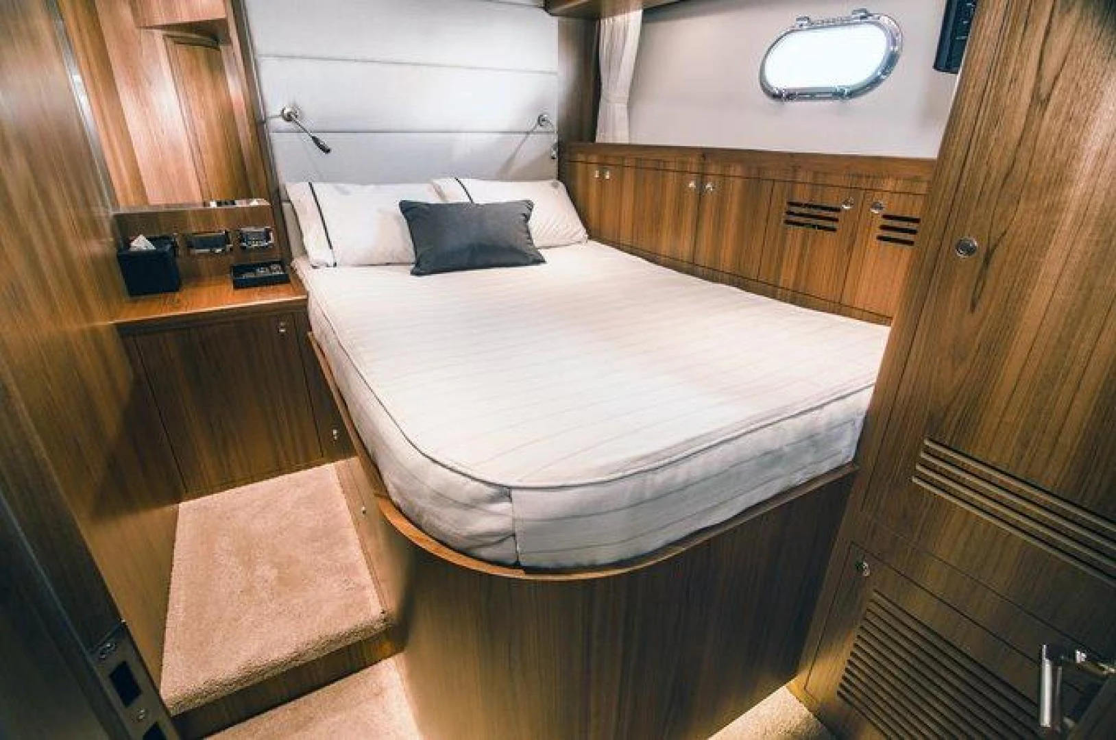 a bed in a room aboard JOHNSON 80' FLYBRIDGE W/FISHING COCKPIT Yacht for Sale