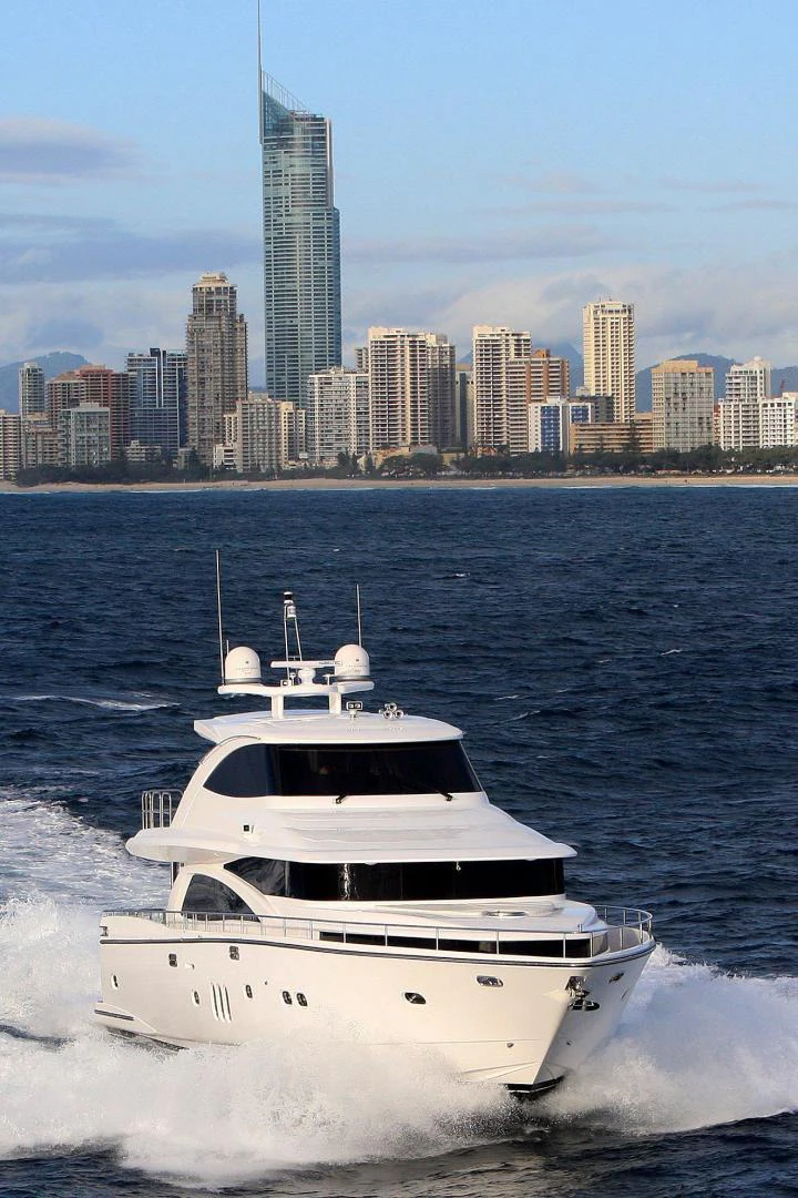 a boat on the water aboard JOHNSON 80' FLYBRIDGE W/FISHING COCKPIT Yacht for Sale